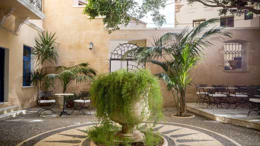 Hotel courtyard with seating area and plants