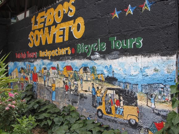 Close up of painted sign for Lebo's Soweto tours