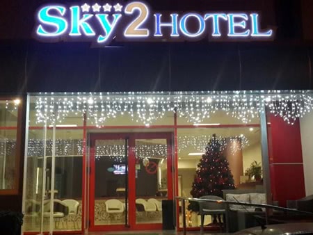 Exterior view and entrance of the hotel Sky 2 in Tirana