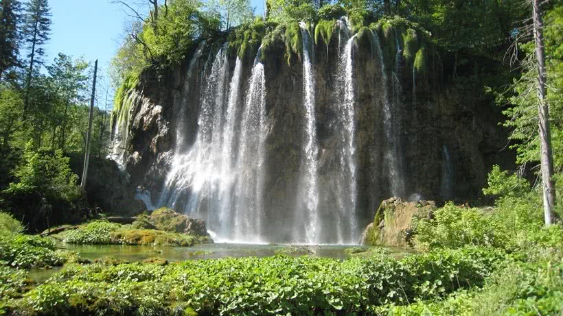 A lower perspective of waterfalls in the Plitvice Lakes National Park in Croatia