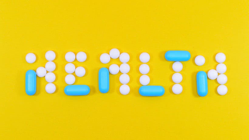 a photo of the word health spelled using pills