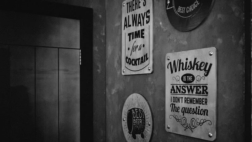 Black and white picture of signs on a wall