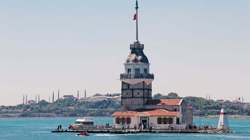 Maiden's Tower on small island with view of Istanbul in background